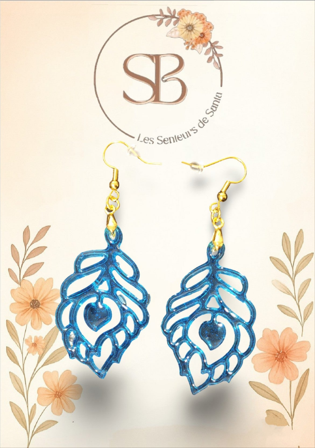 Boucles d’oreilles pendantes feuille bleue